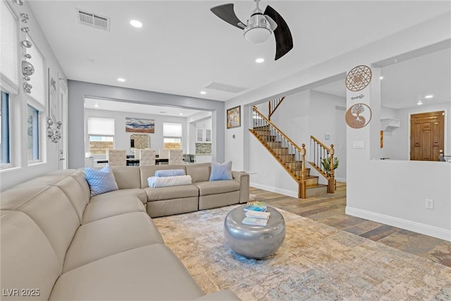 living room with ceiling fan and wood-type flooring