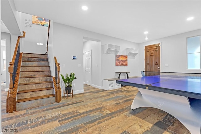 dining space with wood-type flooring