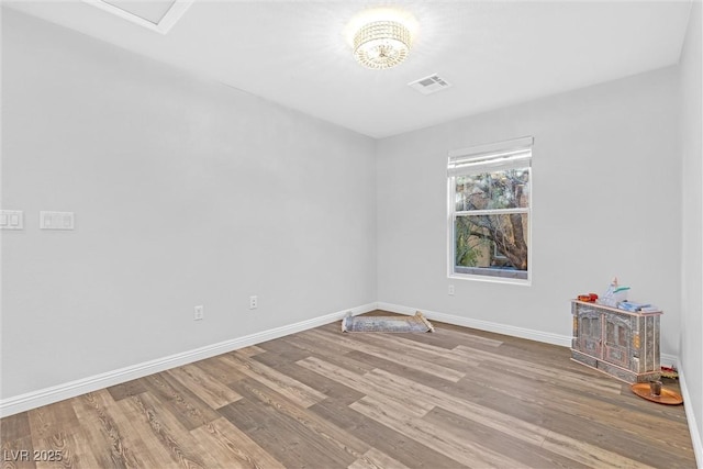 empty room featuring hardwood / wood-style flooring