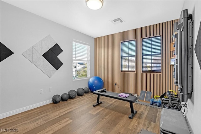 exercise area featuring hardwood / wood-style floors