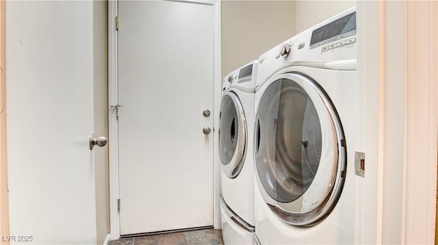 clothes washing area featuring independent washer and dryer