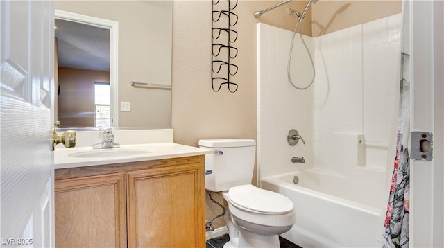 full bathroom featuring shower / tub combo with curtain, vanity, and toilet