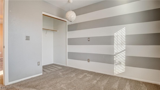 walk in closet with carpet floors