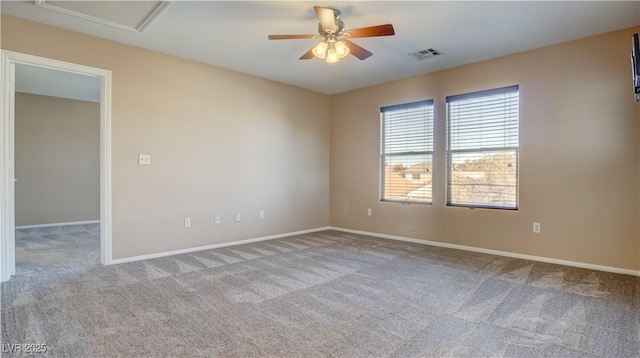 unfurnished room with light carpet and ceiling fan