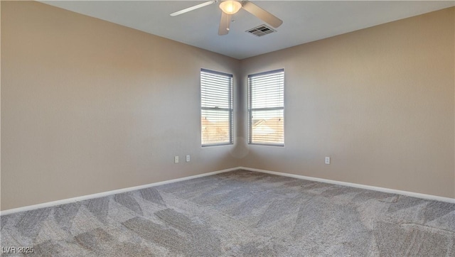 carpeted empty room featuring ceiling fan