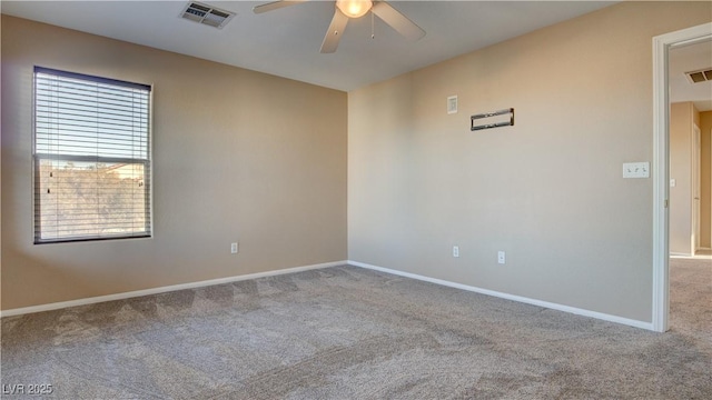 unfurnished room featuring light carpet and ceiling fan