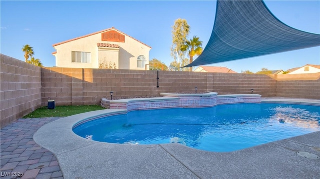 view of swimming pool with a patio