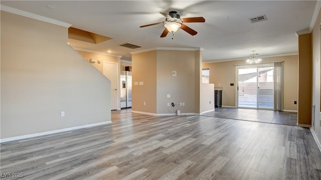 unfurnished living room featuring crown molding, wood-type flooring, and ceiling fan with notable chandelier