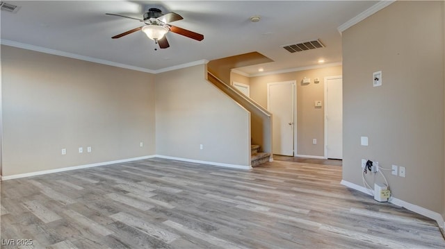 empty room featuring ceiling fan, ornamental molding, and light hardwood / wood-style floors