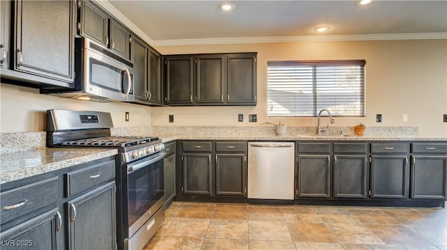 kitchen with appliances with stainless steel finishes, sink, crown molding, light stone countertops, and dark brown cabinets