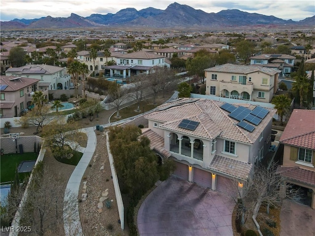 birds eye view of property with a mountain view