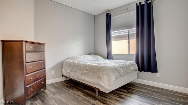 bedroom featuring dark hardwood / wood-style flooring