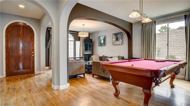 rec room with pool table and light hardwood / wood-style floors