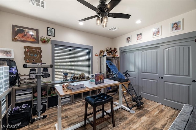 office space with ceiling fan and hardwood / wood-style floors