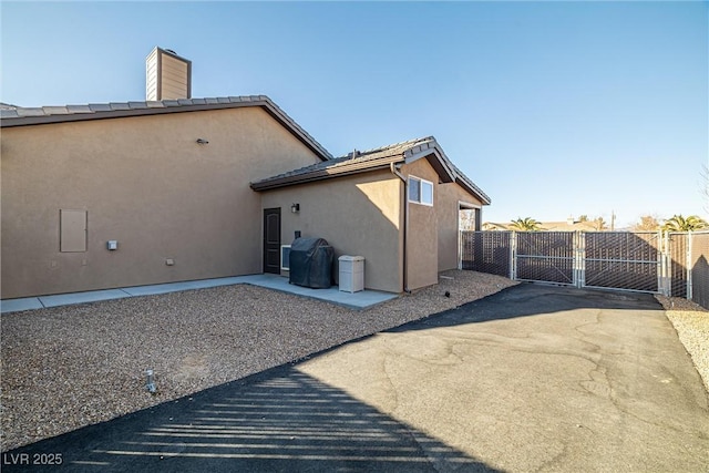 back of house with a patio