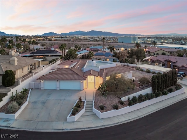 aerial view at dusk with a mountain view