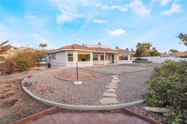 back of house featuring a patio area