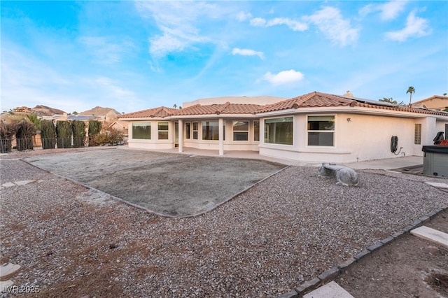 back of property featuring a patio