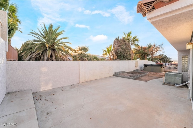 view of patio / terrace featuring a hot tub