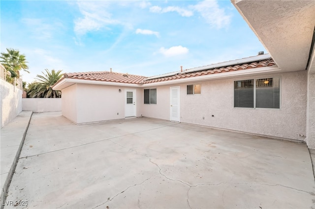 back of property with a patio area