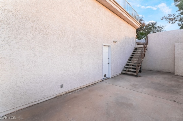 view of property exterior featuring a patio