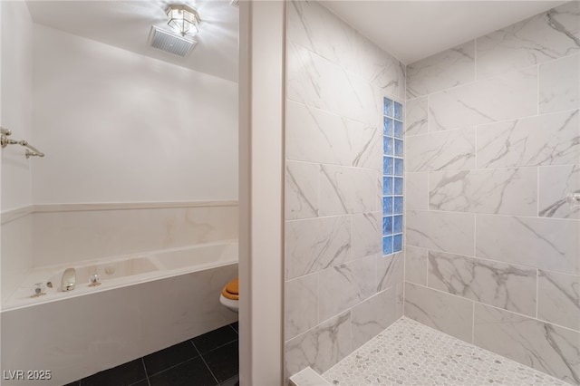 bathroom featuring shower with separate bathtub and tile patterned flooring