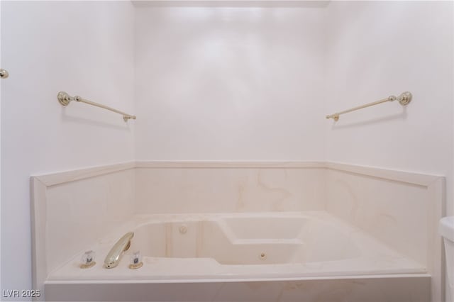 bathroom featuring tiled bath