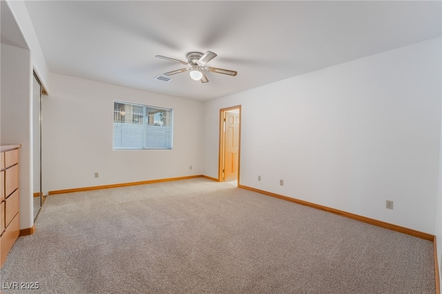 unfurnished bedroom with ceiling fan and light carpet