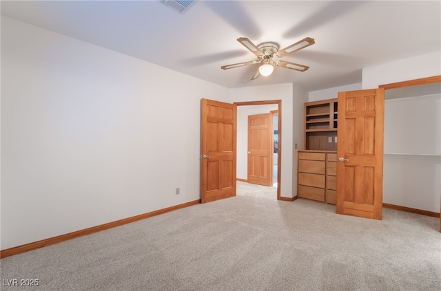 unfurnished bedroom featuring light colored carpet and ceiling fan