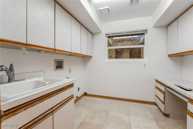 laundry area featuring cabinets, sink, hookup for an electric dryer, and hookup for a washing machine