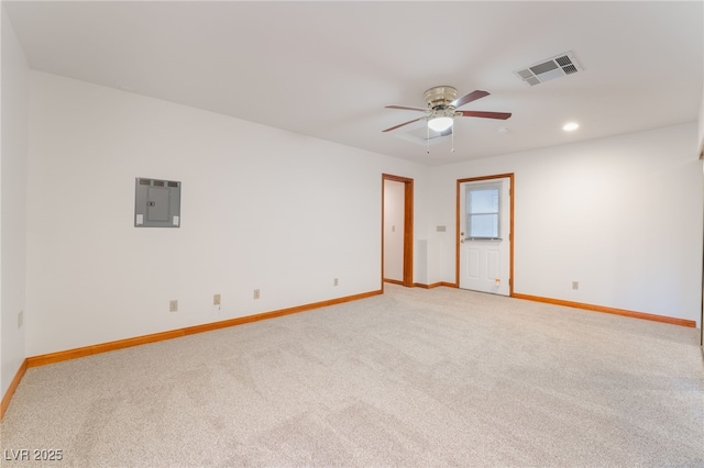 carpeted spare room with electric panel and ceiling fan