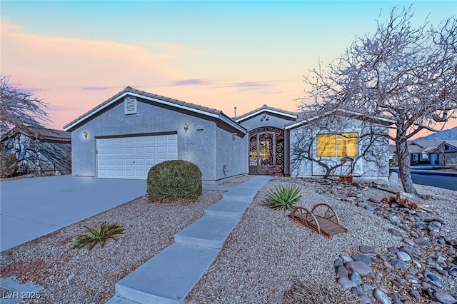 ranch-style house featuring a garage