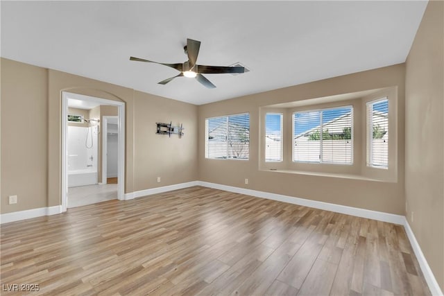 spare room with ceiling fan and light hardwood / wood-style flooring