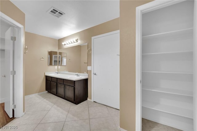 bathroom featuring tile patterned floors and vanity