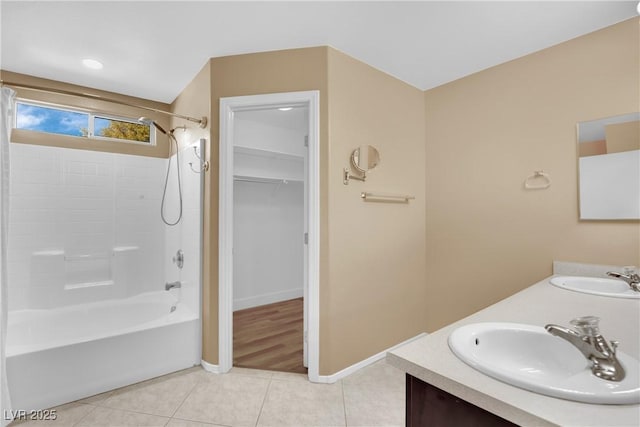 bathroom with vanity, tile patterned floors, and washtub / shower combination