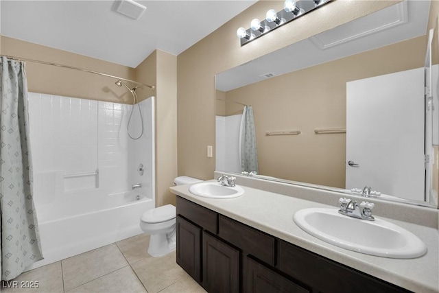 full bathroom with shower / bath combination with curtain, tile patterned floors, toilet, and vanity