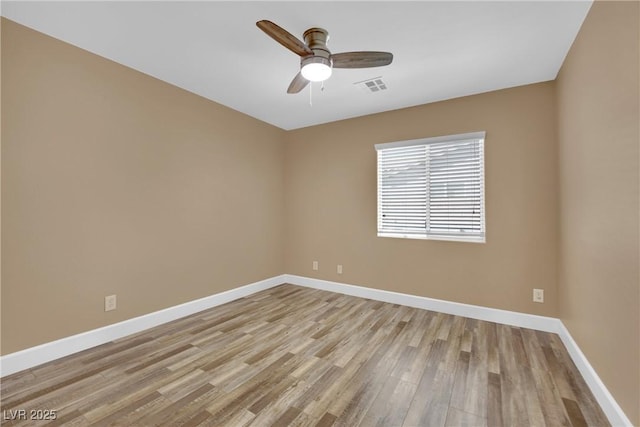 unfurnished room with ceiling fan and light hardwood / wood-style flooring