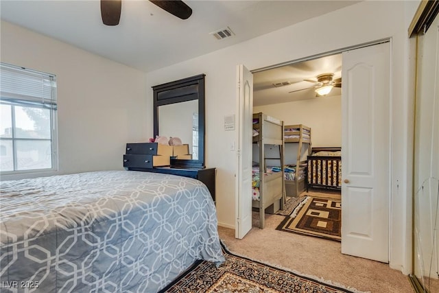 carpeted bedroom featuring ceiling fan