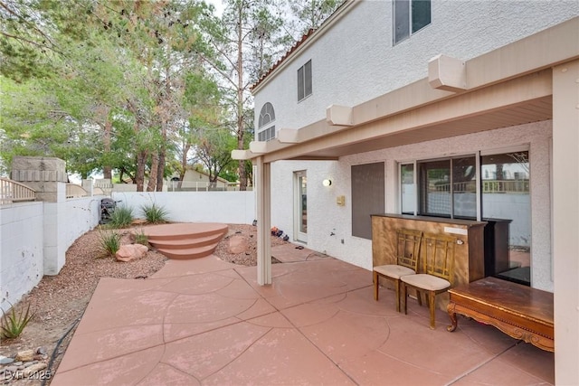 view of patio / terrace featuring exterior bar