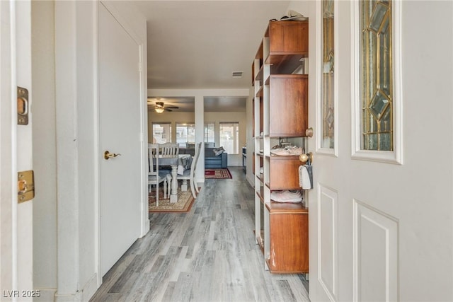 hallway featuring light wood-type flooring