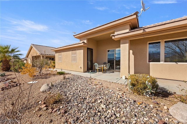 rear view of property with a patio area