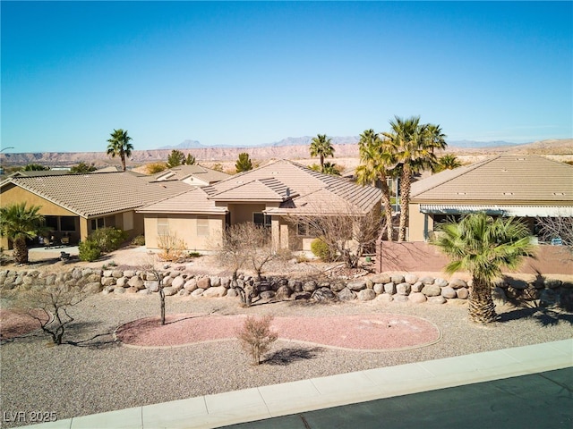 ranch-style home with a mountain view