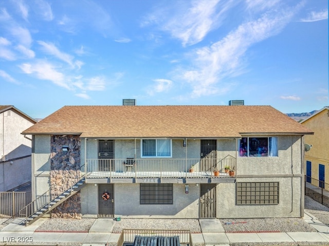 view of front of property with a balcony