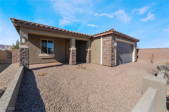 back of property featuring a garage