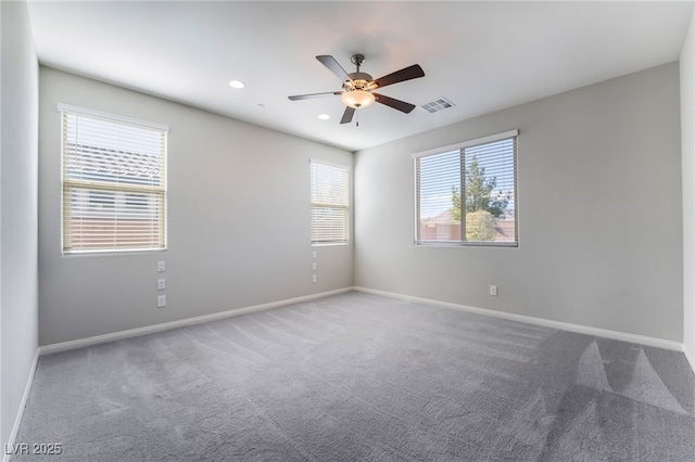 unfurnished room featuring carpet and ceiling fan