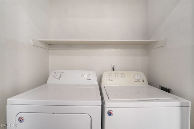 washroom featuring laundry area and washer and clothes dryer