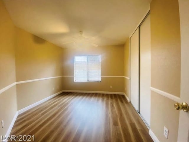 spare room with wood-type flooring