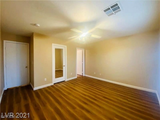 unfurnished bedroom featuring dark hardwood / wood-style floors