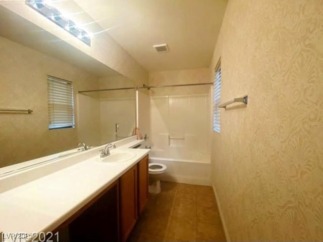 full bathroom with tile patterned flooring, vanity, toilet, and washtub / shower combination