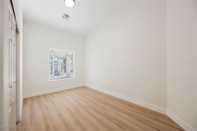 empty room with light hardwood / wood-style floors